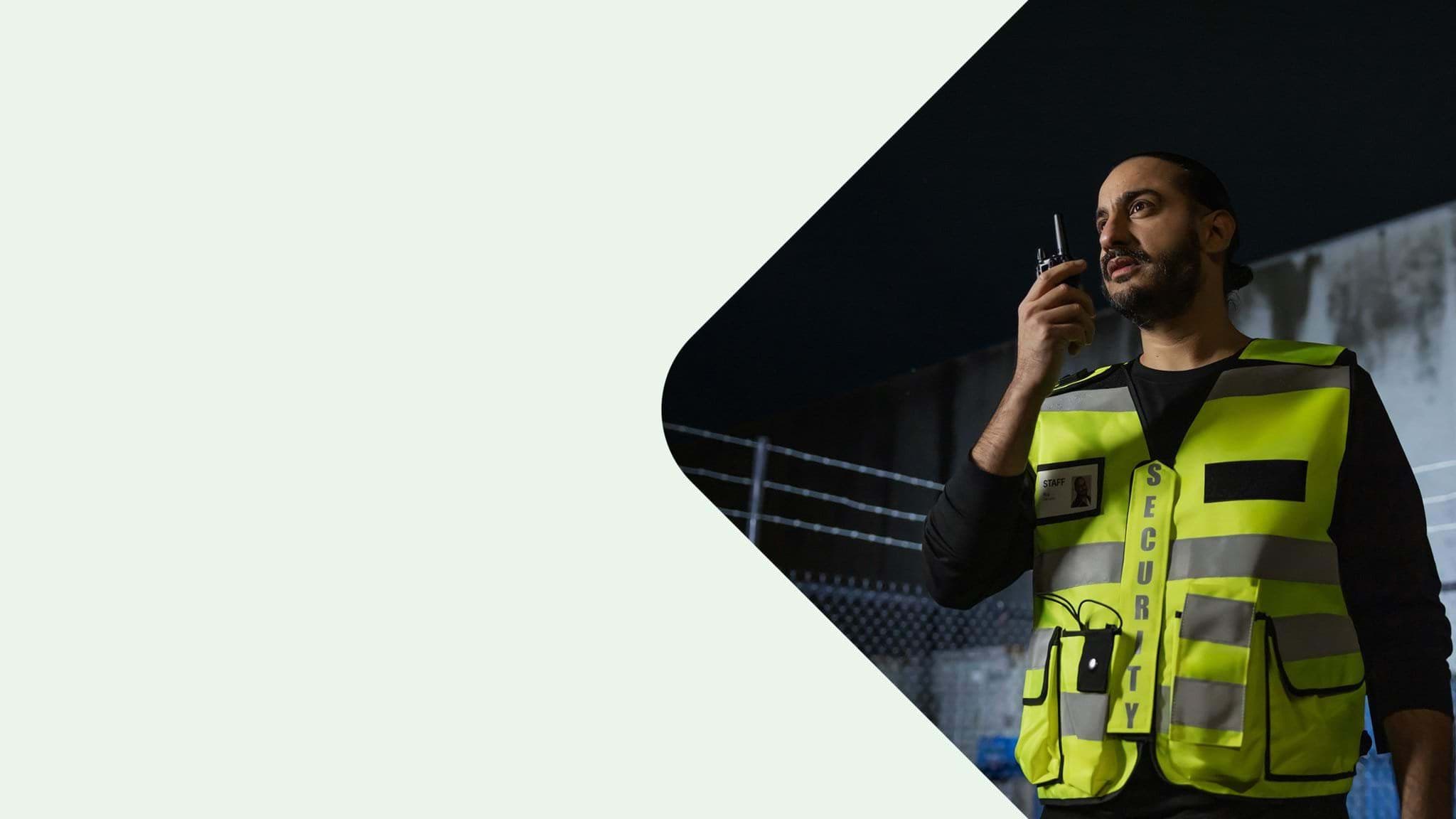 Security guard with walkie-talkie.